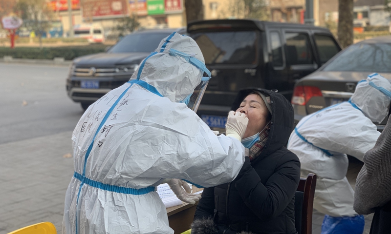 Residents in Luoyang city in Central China's Henan Province took nucleic acid tests on January 2, 2022. Photo: VCG