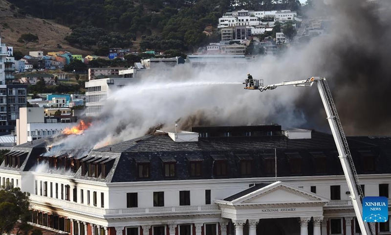 A firefighter battles the fire that flares up again on the National Assembly building in Cape Town, South Africa, on Jan. 3, 2022.(Photo: Xinhua)