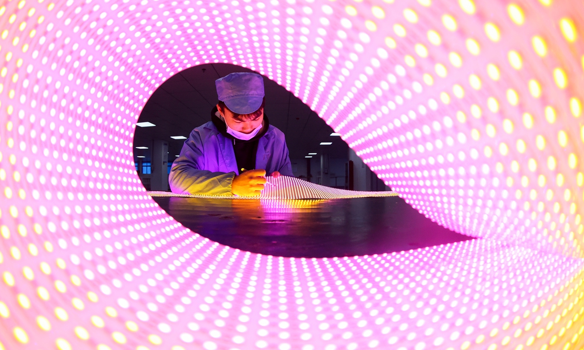 A worker tests LEDs in a factory in Ruichang, East China's Jiangxi Province on January 4, 2022. China's total imports and exports of goods are estimated to have reached $6 trillion in 2021, the Ministry of Commerce said recently, which would be up more than 20 percent from a year earlier. Photo: cnsphoto