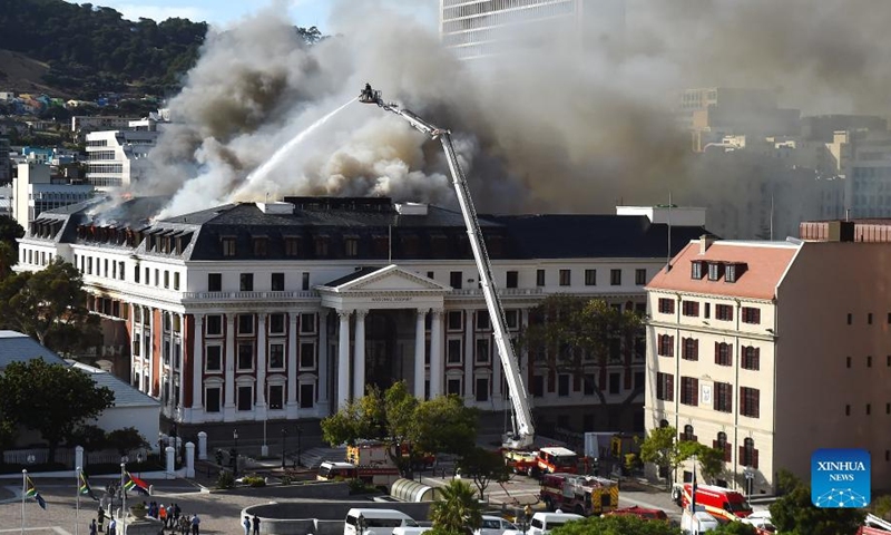 A firefighter battles the fire that flares up again on the National Assembly building in Cape Town, South Africa, on Jan. 3, 2022.(Photo: Xinhua)