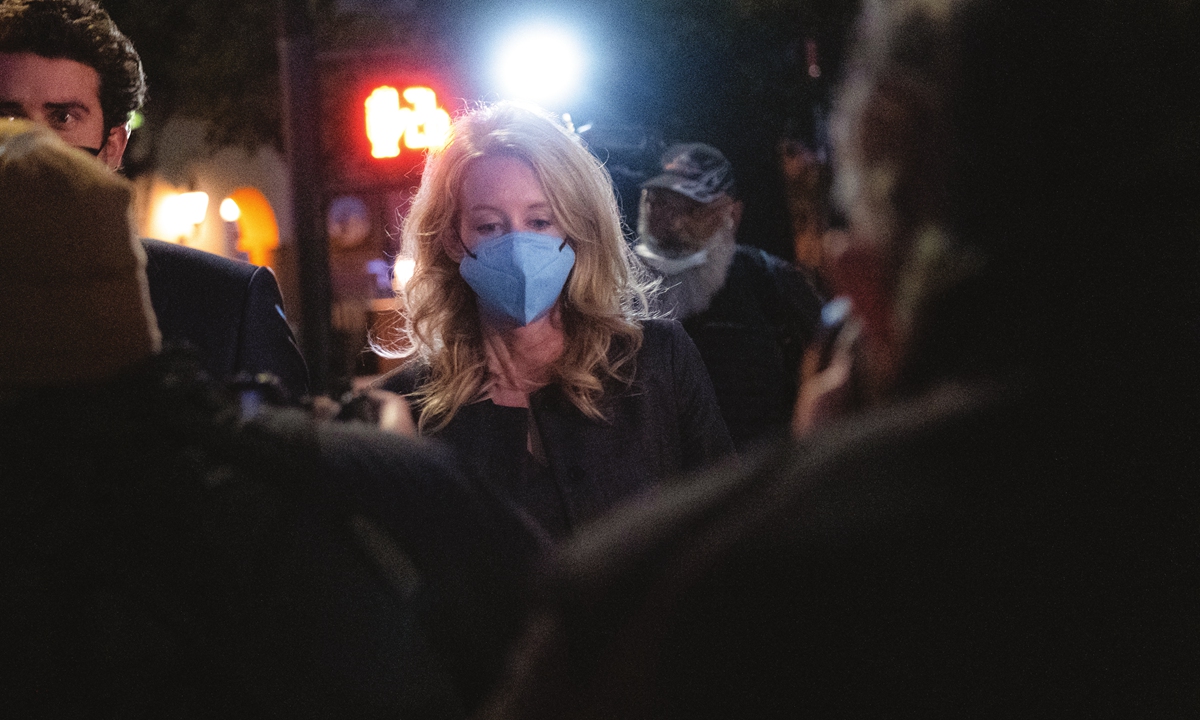 Elizabeth Holmes (center) and partner Billy Evans, walk outside the federal court after she was found guilty on four of 11 accounts faced in her fraud trial in San Jose, California, the US, on January 3, 2022. Photo: AFP