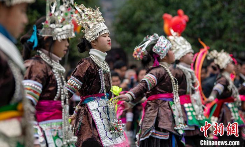 Students of Miao ethnic group perform the traditional Lusheng (reed-pipe instrument) dance at Congjiang county, southwest China's Guizhou province. (Photo: China News service/Wu Dejun)
