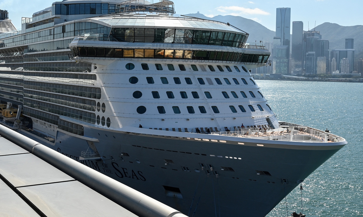 The cruise ship Spectrum of the Seas docks in Hong Kong on January 5, 2022, after it was ordered to return to the city for COVID-19 testing after nine people were found to be close contacts with a recent Omicron variant outbreak. Photo: AFP