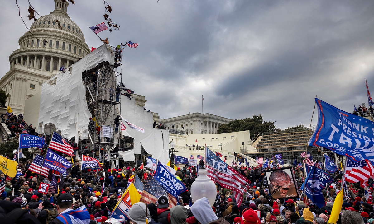 Trump supporters clash with police and security forces as people try to storm the US Capitol on January 6, 2021 in Washington, DC.  Photo: AFP