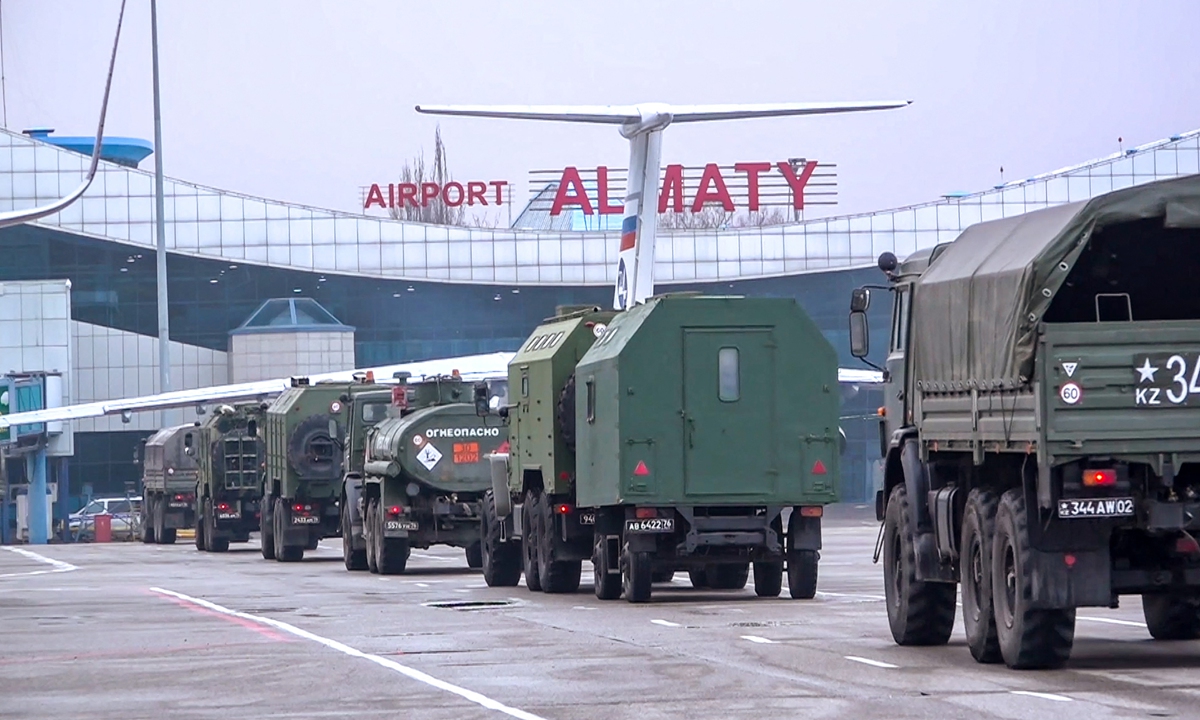 Russian military vehicles moving along an airfield after a military cargo plane landing in Almaty, Kazakhstan on January 9, 2022. 