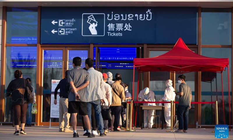 Passengers line up to enter the Vientiane Station of the China-Laos Railway in Vientiane, Laos, Dec. 12, 2021.(Photo: Xinhua)