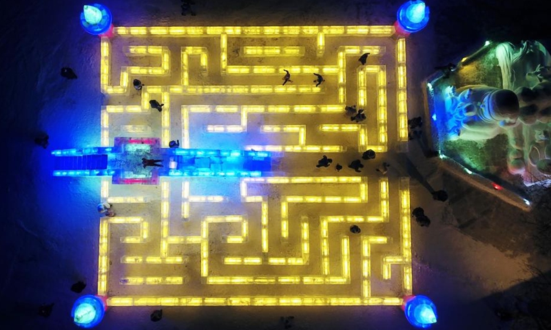 In this aerial photo, people visit the 48th Harbin ice lantern fair in Harbin, northeast China's Heilongjiang Province, Jan. 5, 2022. The ice lantern fair kicked off here on Wednesday.(Photo: Xinhua)