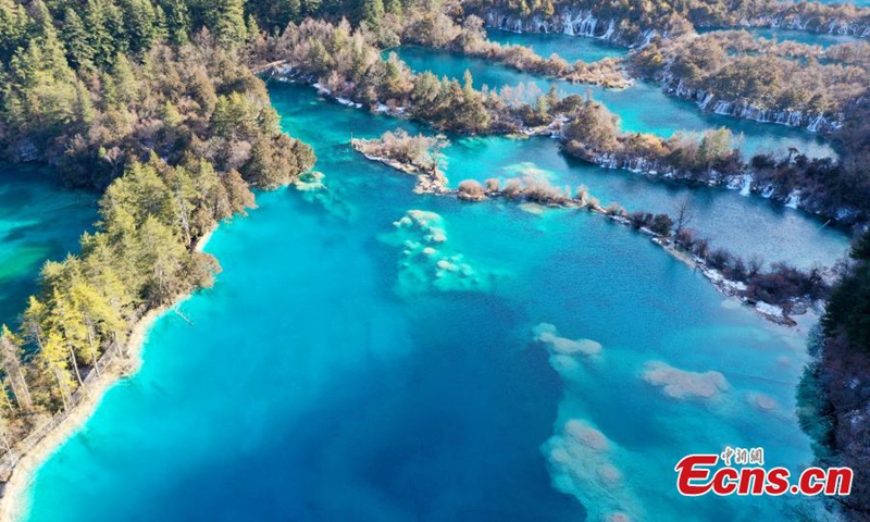 Aerial photo of the Sparkling Lake (Huo Hua Hai) at Jiuzhaigou National Park in the Aba Tibetan and Qiang Autonomous Prefecture, southwest China's Sichuan Province, Jan. 5, 2022. (Photo by An Yuan)