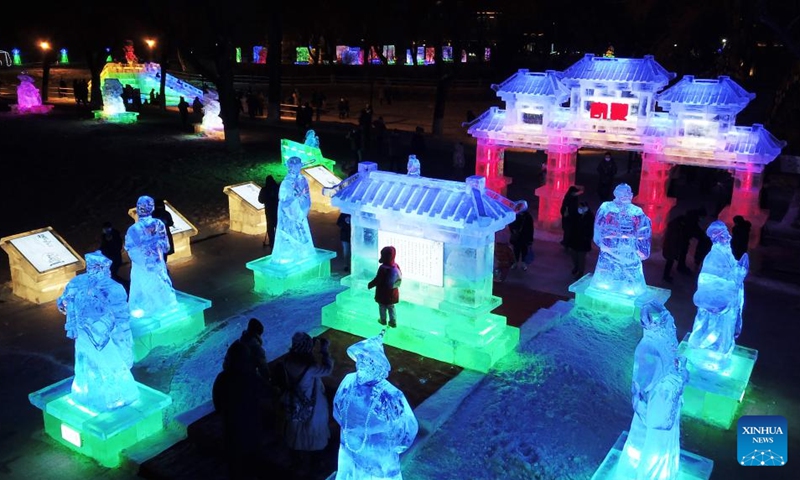 In this aerial photo, people visit the 48th Harbin ice lantern fair in Harbin, northeast China's Heilongjiang Province, Jan. 5, 2022.The ice lantern fair kicked off here on Wednesday.(Photo: Xinhua)