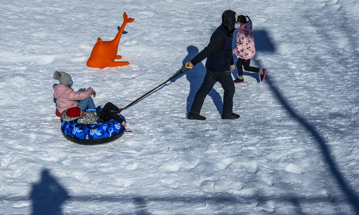 People have fun on the ice in a park in Beijing on January 2, 2022. Photo: VCG