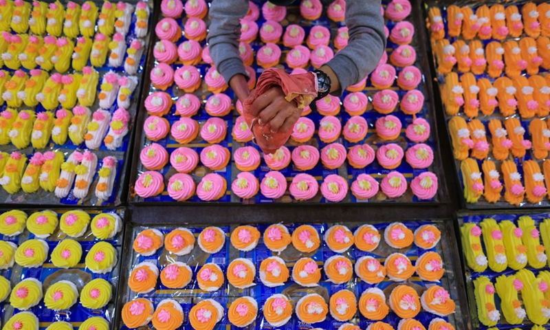 A Palestinian worker makes sugar candy in a sweet factory in Gaza City, on Feb. 4, 2019.(Photo: Xinhua)