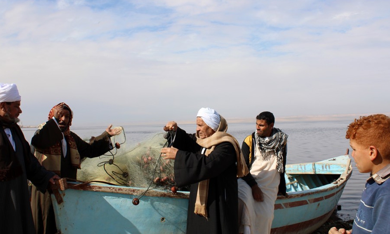 Fishermen are seen by the Lake Qarun in Fayoum Province, Egypt, on Jan. 4, 2022.(Photo: Xinhua)