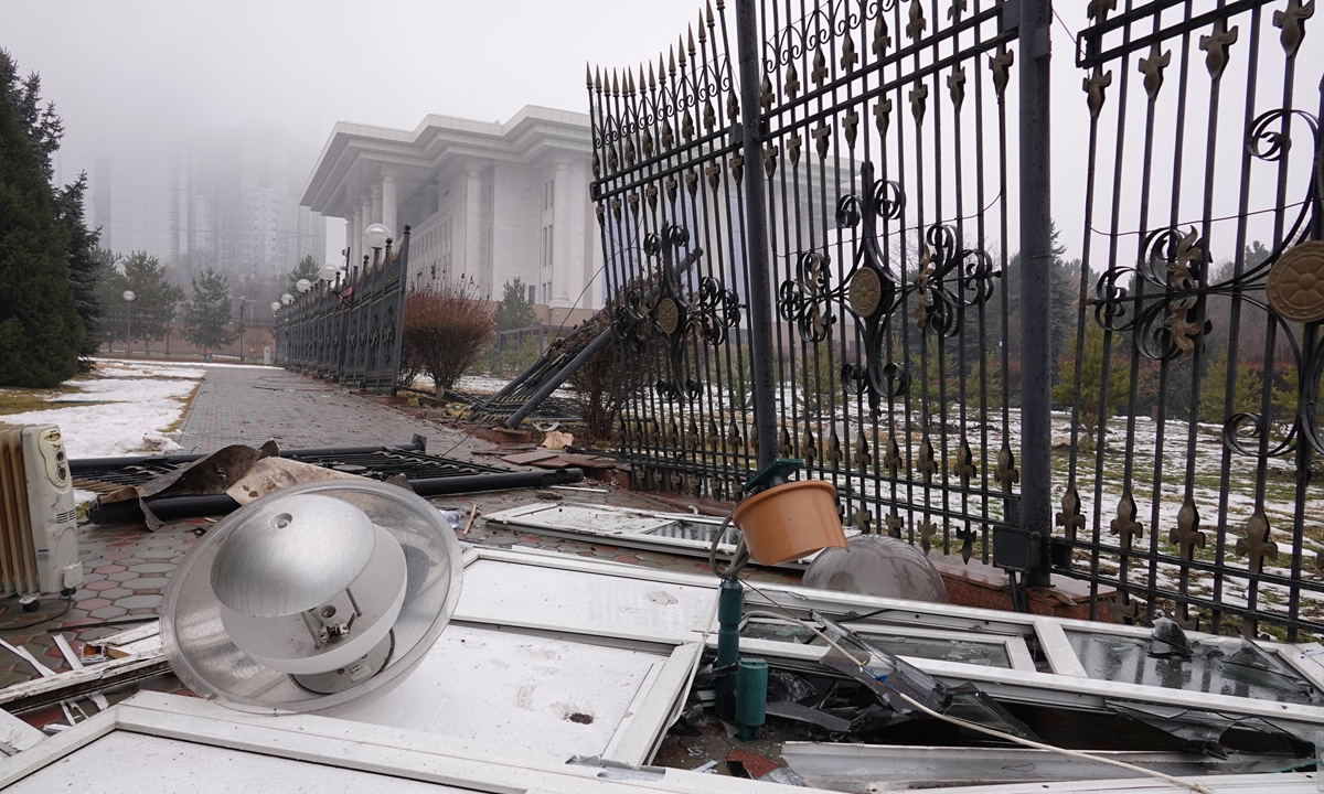 A picture taken on Friday shows a destroyed fence near an administrative building in central Almaty, after violence that erupted following protests over hikes in fuel prices. Photo: AFP