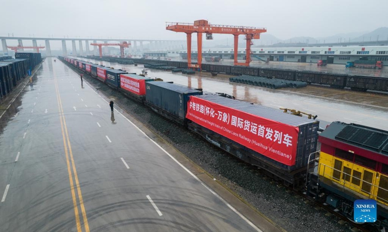 Aerial photo taken on Jan. 6, 2022 shows an outbound freight train heading for Laos from Huaihua City, central China's Hunan Province.Photo:Xinhua
