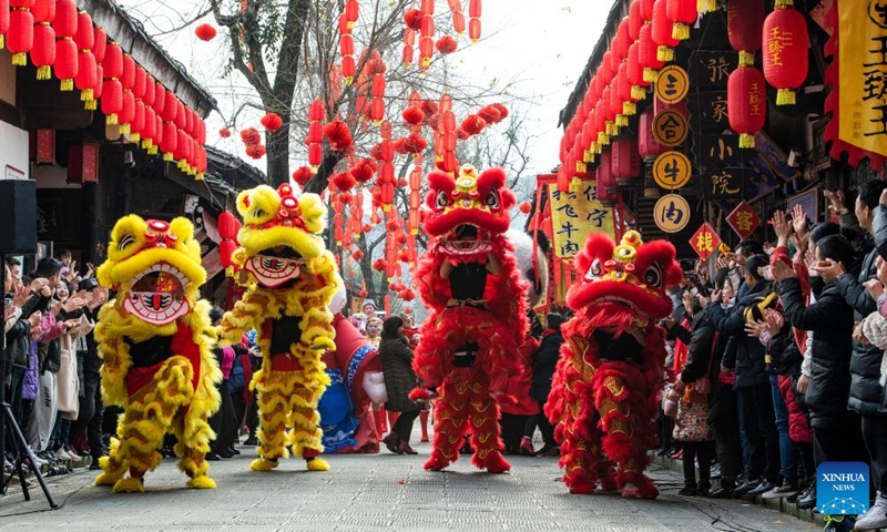 People perform lion dance at Langzhong ancient town in southwest China's Sichuan Province, Jan. 8, 2022.Photo:Xinhua