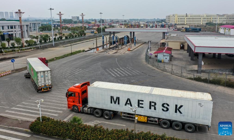 Aerial photo taken on Jan. 8, 2022 shows trucks waiting to pass an immigration inspection checkpoint in Dongxing, south China's Guangxi Zhuang Autonomous Region.Photo:Xinhua