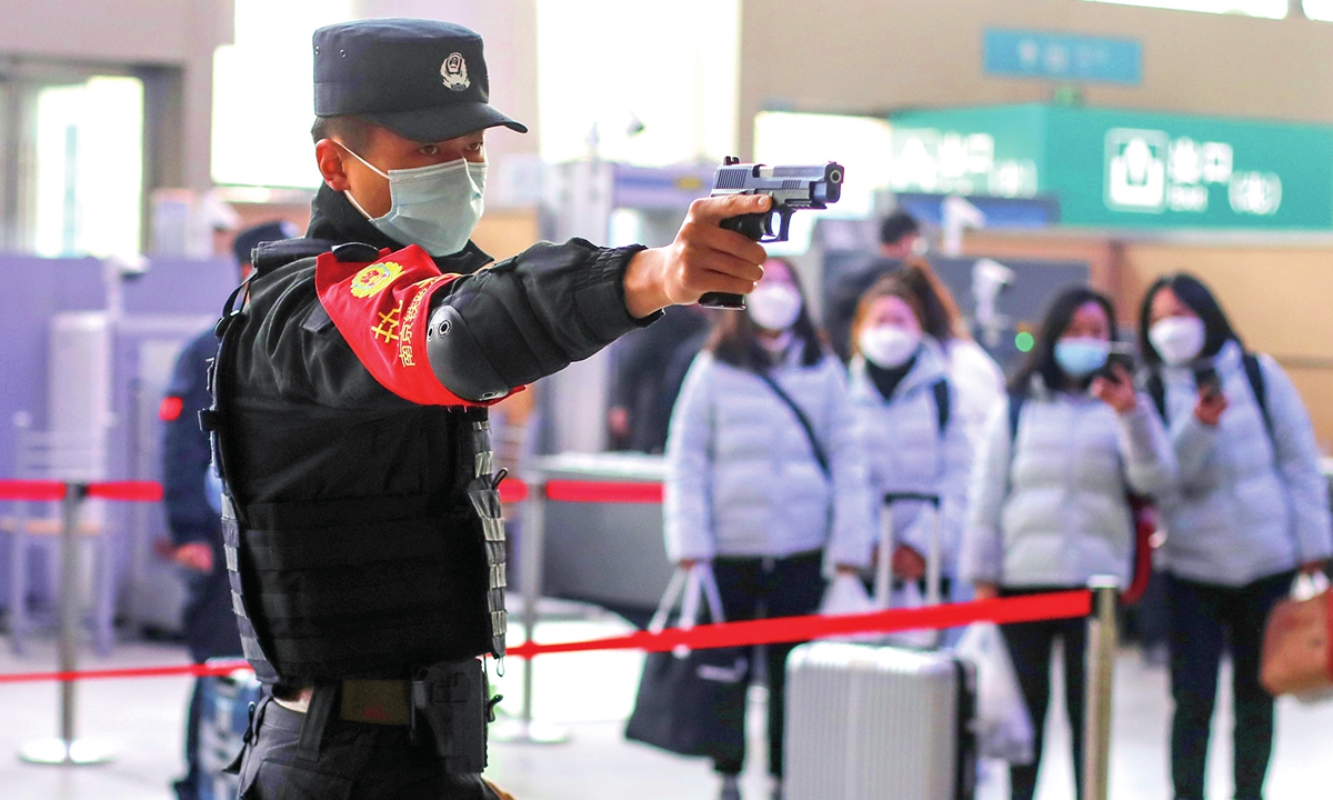 A railway police officer participates in a drill at a railway station in Nanjing, East China's Jiangsu Province on January 7, 2022. Photo: VCG