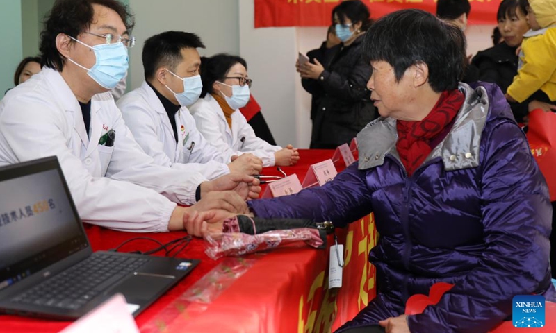 Doctors give free clinical treatment to migrant workers at a cosmetics company in Wuxing District of Huzhou, east China's Zhejiang Province, Jan. 8, 2022.Photo:Xinhua