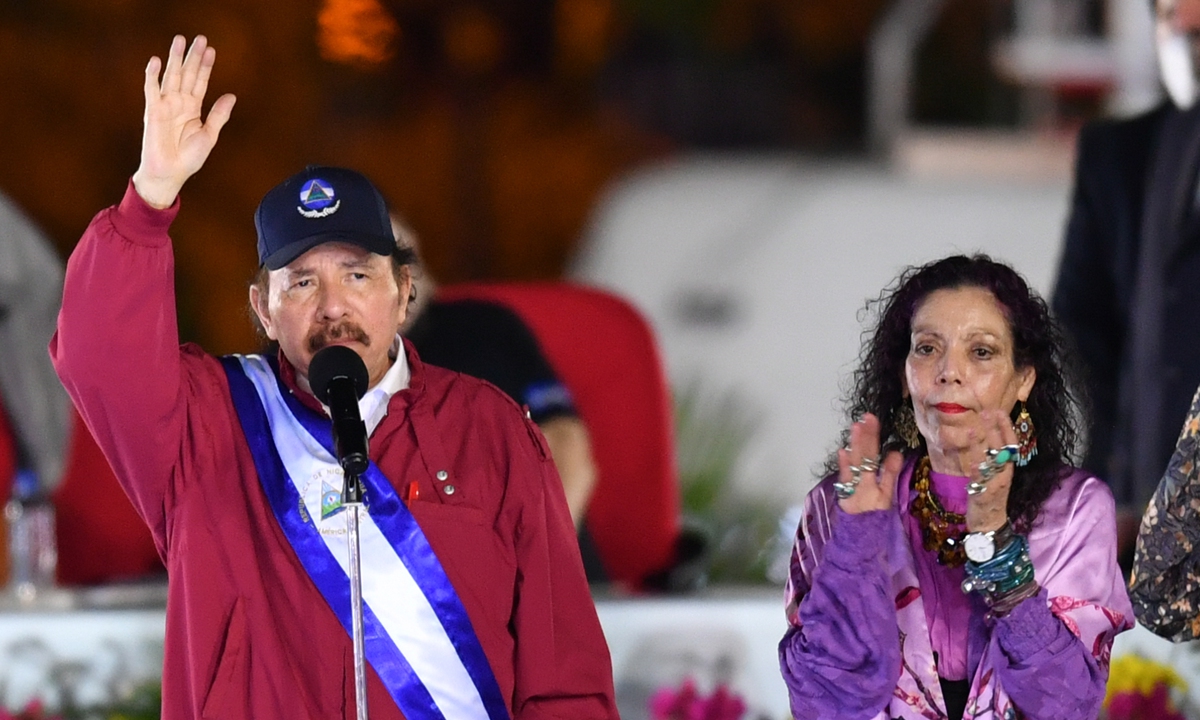 Nicaraguan President Daniel Ortega raises his hand as he is sworn in as president for a fourth straight term next to his wife and vice-president Rosario Murillo during the inauguration ceremony in Managua on January 10, 2022. Photo: Xinhua