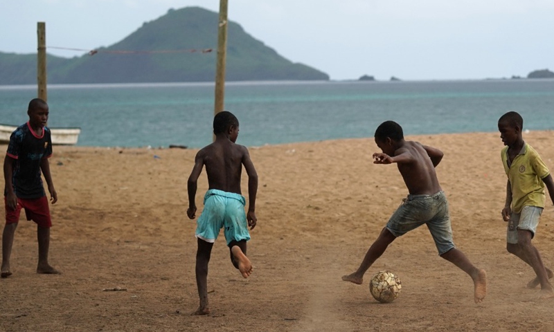 Boys play football on the beach in Moheli, Comoros, Jan. 8, 2022.(Photo: Xinhua)
