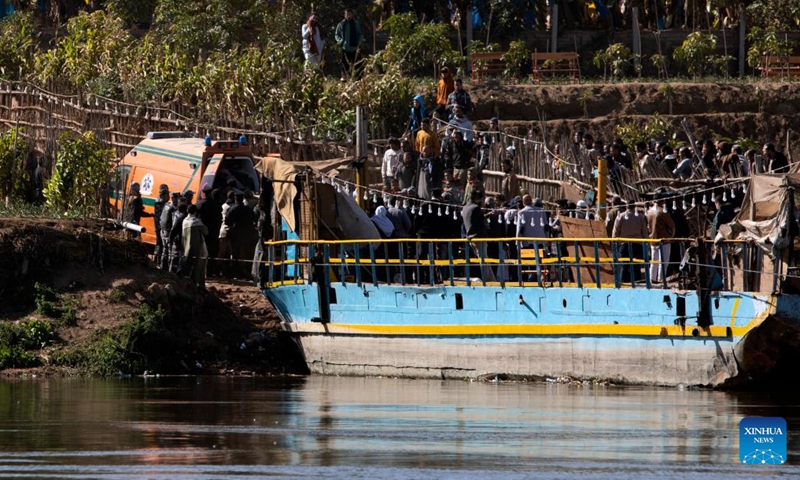 Rescuers work at the site where a truck plunged into the Nile River in Giza, Egypt, on Jan. 11, 2022. At least two people were killed and eight others are still missing in Egypt as a truck with 24 passengers plunged into the Nile River near the capital Cairo, the Egyptian public prosecution said in a statement on Tuesday.(Photo: Xinhua)