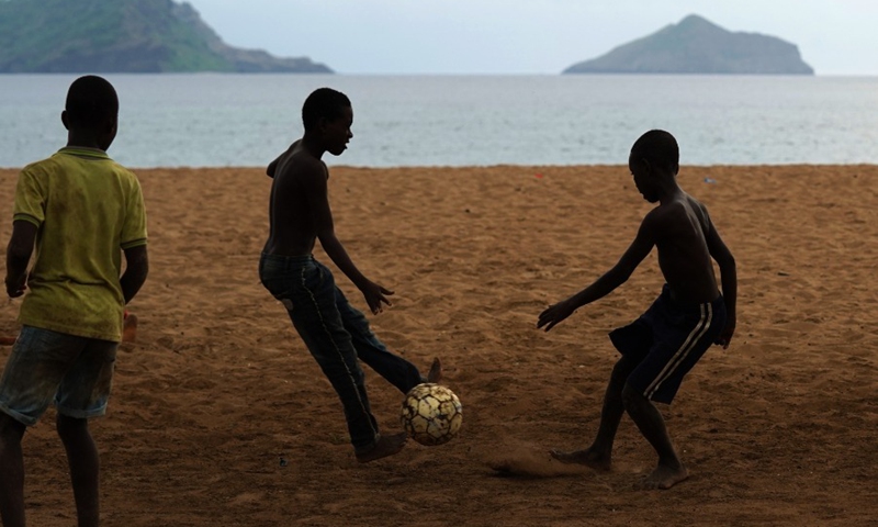 Boys play football on the beach in Moheli, Comoros, Jan. 8, 2022.(Photo: Xinhua)