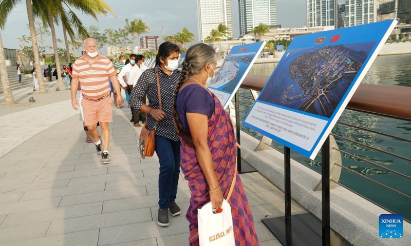 Photo taken on Jan. 10, 2022 shows people visiting a photo exhibition at the Marina in Colombo's Port City, Sri Lanka. The Marina of Colombo's Port City was officially opened to the public on Monday. (Photo: Xinhua)