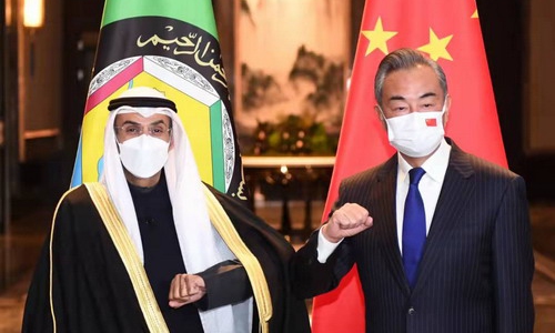 Chinese State Councilor and Foreign Minister Wang Yi (right) meets with Nayef bin Falah Al-Hajraf, secretary-general of the GCC, on Tuesday in Wuxi, East China's Jiangsu Province. Photo: fmprc.gov.cn