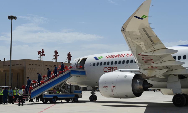 Staff members of a C919 large passenger aircraft disembark from the plane at the Turpan Jiaohe Airport in Turpan, northwest China's Xinjiang Uygur Autonomous Region, June 28, 2020. Photo: Xinhua