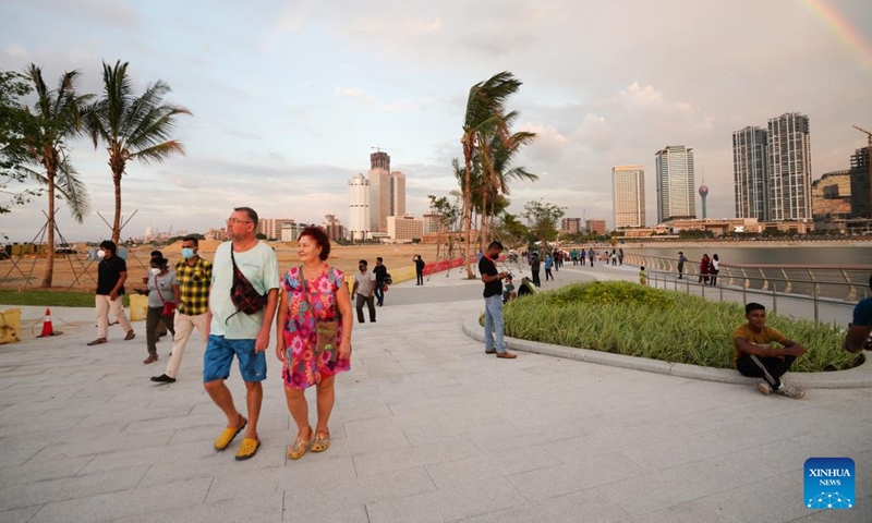 Photo taken on Jan. 10, 2022 shows tourists walking at the Marina in Colombo's Port City, Sri Lanka. The Marina of Colombo's Port City was officially opened to the public on Monday.(Photo: Xinhua)