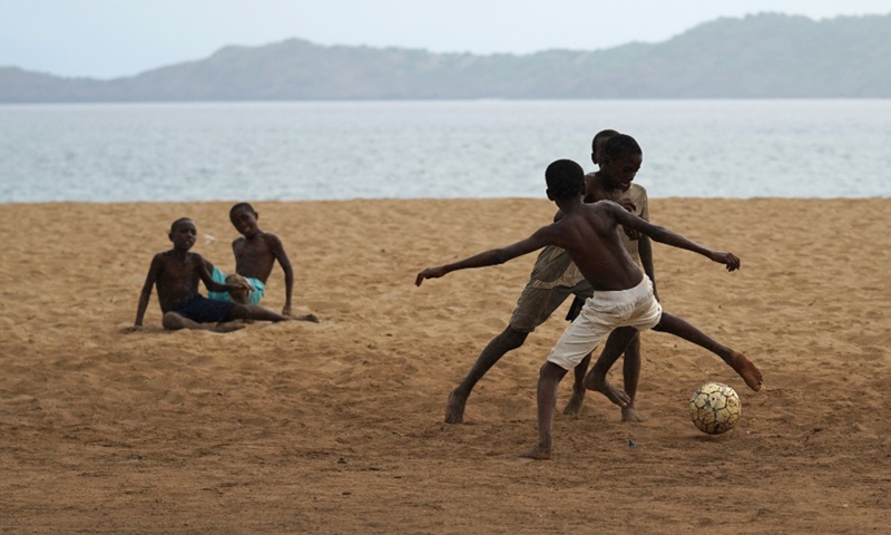 Boys play football on the beach in Moheli, Comoros, Jan. 8, 2022.(Photo: Xinhua)