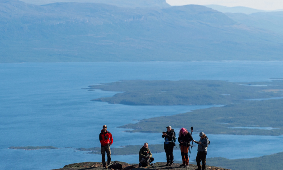 Tourists visit Mount Nuolja, where scientists and researchers were investigating the impact on climate change in many aspects of the Arctic in Sweden on August 26, 2021.Photo: AFP