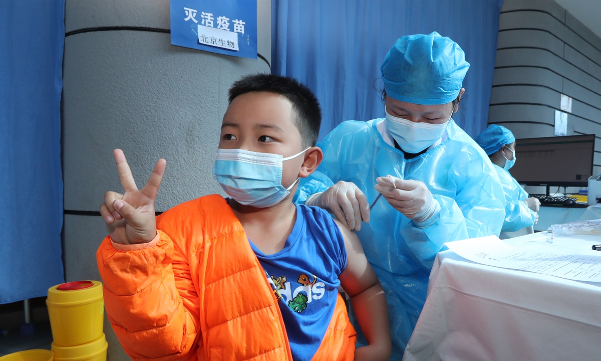 Medical staff give COVID-19 vaccines  to students in Kunming,  Yunnan Province on ?November 6, 2021.