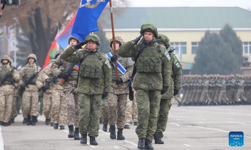The peacekeeping forces of the Collective Security Treaty Organization (CSTO) march on a departure ceremony in Almaty, Kazakhstan, Jan. 13, 2022. The peacekeeping forces of the CSTO have begun the handover of socially significant facilities to Kazakh law enforcement agencies, the Russian Defense Ministry said Thursday.Photo:Xinhua