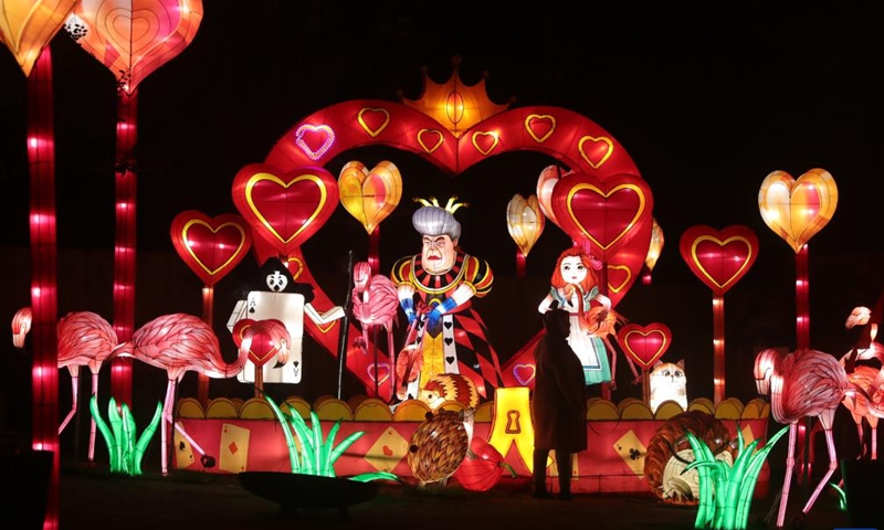 People view light installations during the sixth edition of China light festival themed Alice in Wonderland at the Antwerp Zoo in Antwerp, Belgium, Jan. 12, 2022.(Photo: Xinhua)