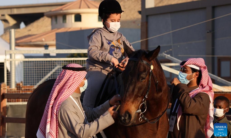 A boy rides on a horse for fun at the Saudi Arabian Horses Festival in Riyadh, Saudi Arabia on Jan. 13, 2022.Photo:Xinhua