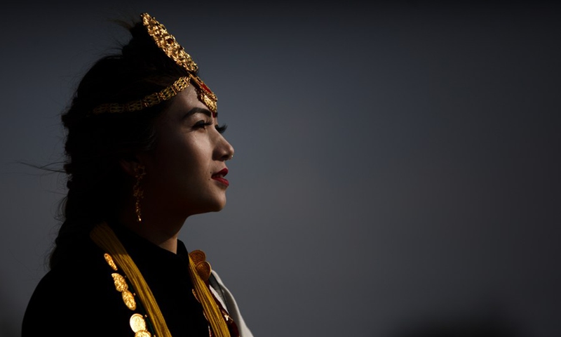 A woman in traditional attire celebrates the Maghe Sankranti Festival in Kathmandu, Nepal, Jan. 15, 2022.Photo:Xinhua