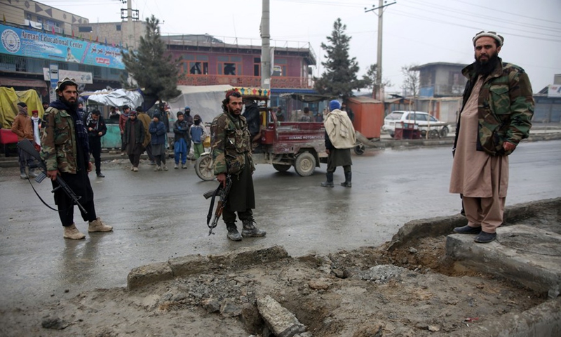 Taliban members inspect the site of a roadside bomb blast in Kabul, Afghanistan, on Jan. 16, 2022.(Photo: Xinhua)