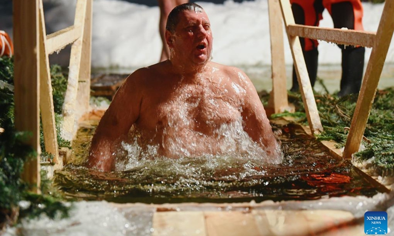 A man bathes in the icy water during the Orthodox Epiphany celebrations in Moscow, Russia, on Jan. 18, 2022.(Photo: Xinhua)