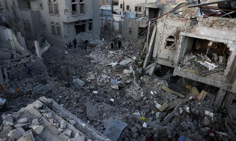 Yemenis inspect and search among the rubble of a house destroyed by airstrikes in Sanaa, Yemen, on Jan. 18, 2022.(Photo: Xinhua)