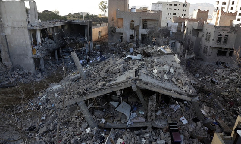 Yemenis inspect and search among the rubble of a house destroyed by airstrikes in Sanaa, Yemen, on Jan. 18, 2022.(Photo: Xinhua)