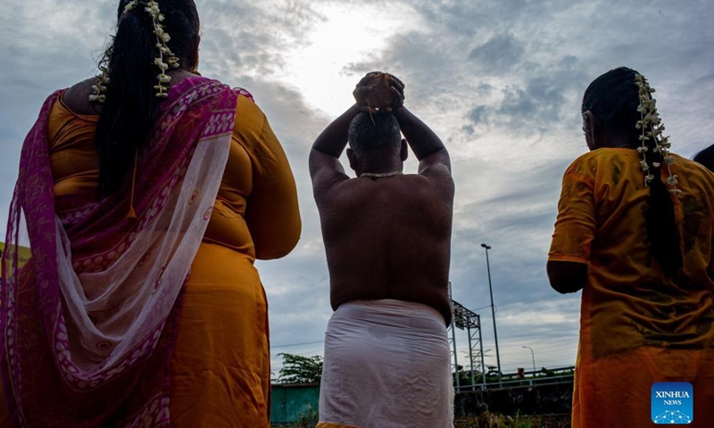 Hindu devotees perform a religious ritual to celebrate the Thaipusam festival at Batu Caves on the outskirts of Kuala Lumpur, Malaysia, Jan. 18, 2022.(Photo: Xinhua)