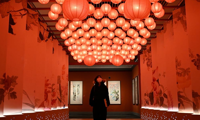 A woman visits a tiger-themed exhibition at the National Museum of China in Beijing, capital of China, Jan. 19, 2022. As the Year of Tiger approaches, The Tiger as Talisman: 2022 Chinese New Year Exhibition, with a selection of artworks showcasing tiger in Chinese culture, opened to the public here on Wednesday.(Photo: Xinhua)