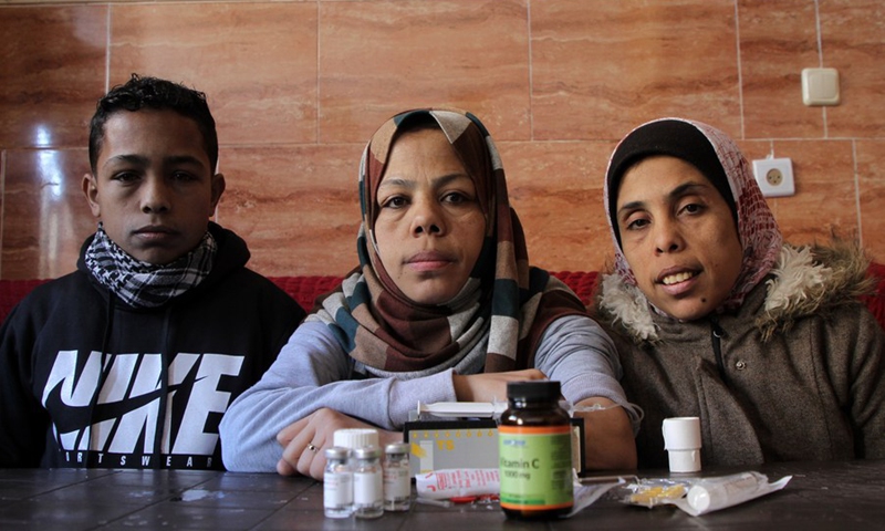 Palestinian thalassemia patients Sawsan (R1), Falastin (C), and Mohammed al-Masri (L) are seen at their house, in the northern Gaza Strip town of Beit Hanoun, on Jan. 17, 2022.(Photo: Xinhua)