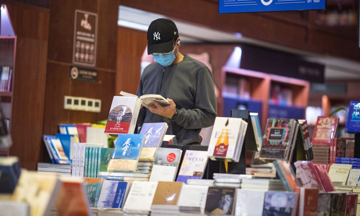 A citizen reads a book at Zall Bookstore in Wuhan, central China's Hubei Province, April 18, 2020. (Xinhua/Xiao Yijiu)