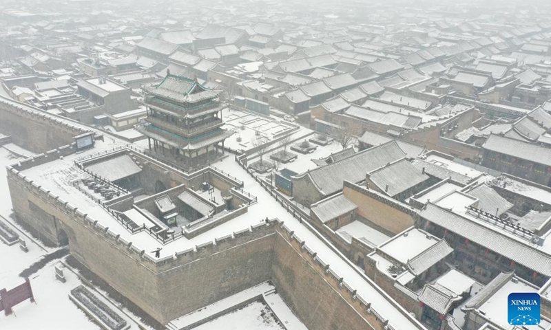 Aerial photo taken on Jan. 21, 2022 shows the snow-covered Pingyao Ancient Town in Jinzhong City, north China's Shanxi Province.Photo:Xinhua