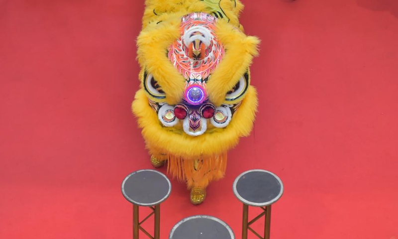 A lion costume is shown onstage as spectators wait for the start of a lion dance in celebration of the upcoming Chinese Lunar New Year in South Tangerang, Indonesia, Jan. 22, 2022.Photo:Xinhua