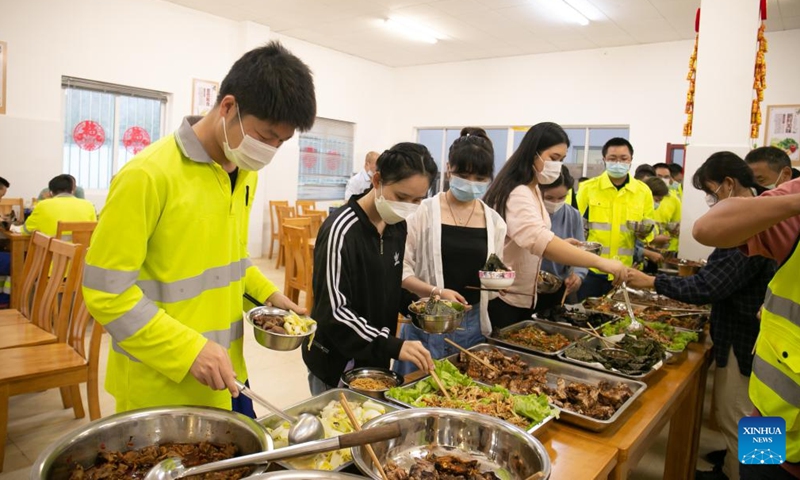 Staff members of the China-Laos Railway Luang Prabang Operation Management Center have dinner at the center in Luang Prabang, Laos, Jan. 22, 2022.Photo:Xinhua