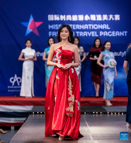 A competitor participates in the final of 2021 Miss International Fashion Travel Pageant in Alameda of San Francisco Bay Area, the United States, Jan. 23, 2022.(Photo: Xinhua)