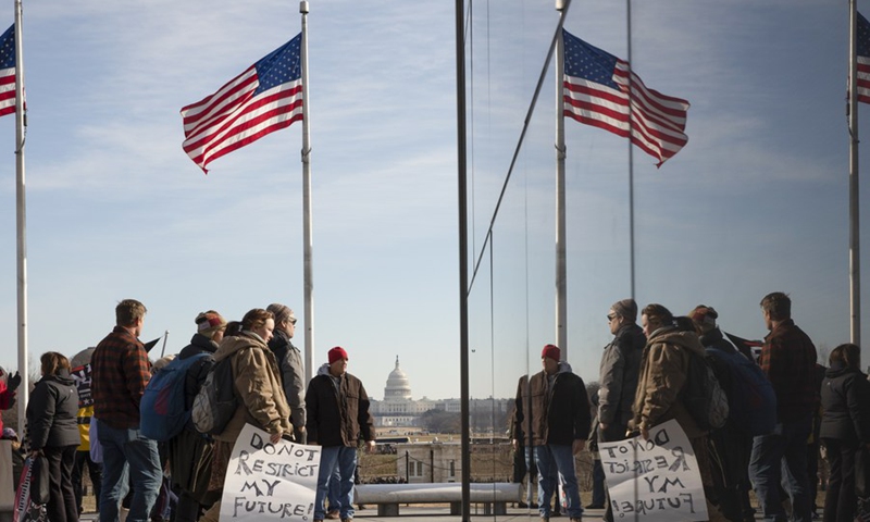 People gather on the National Mall during an event protesting vaccine mandates and other pandemic restrictions in Washington, D.C., the United States, Jan. 23, 2022.(Photo: Xinhua)